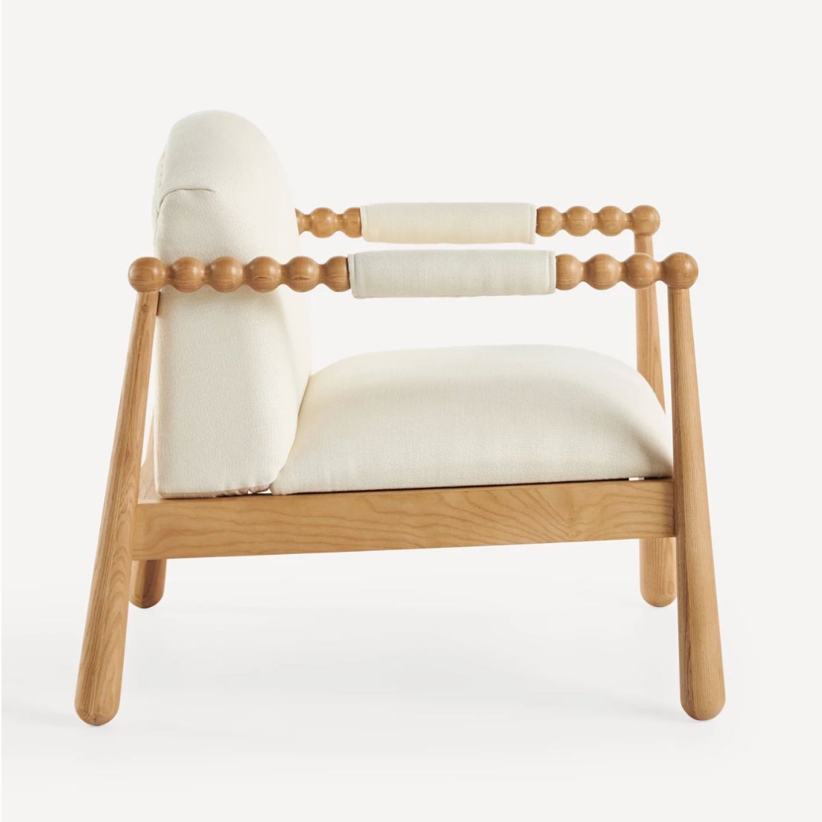 A white bobble arm chair