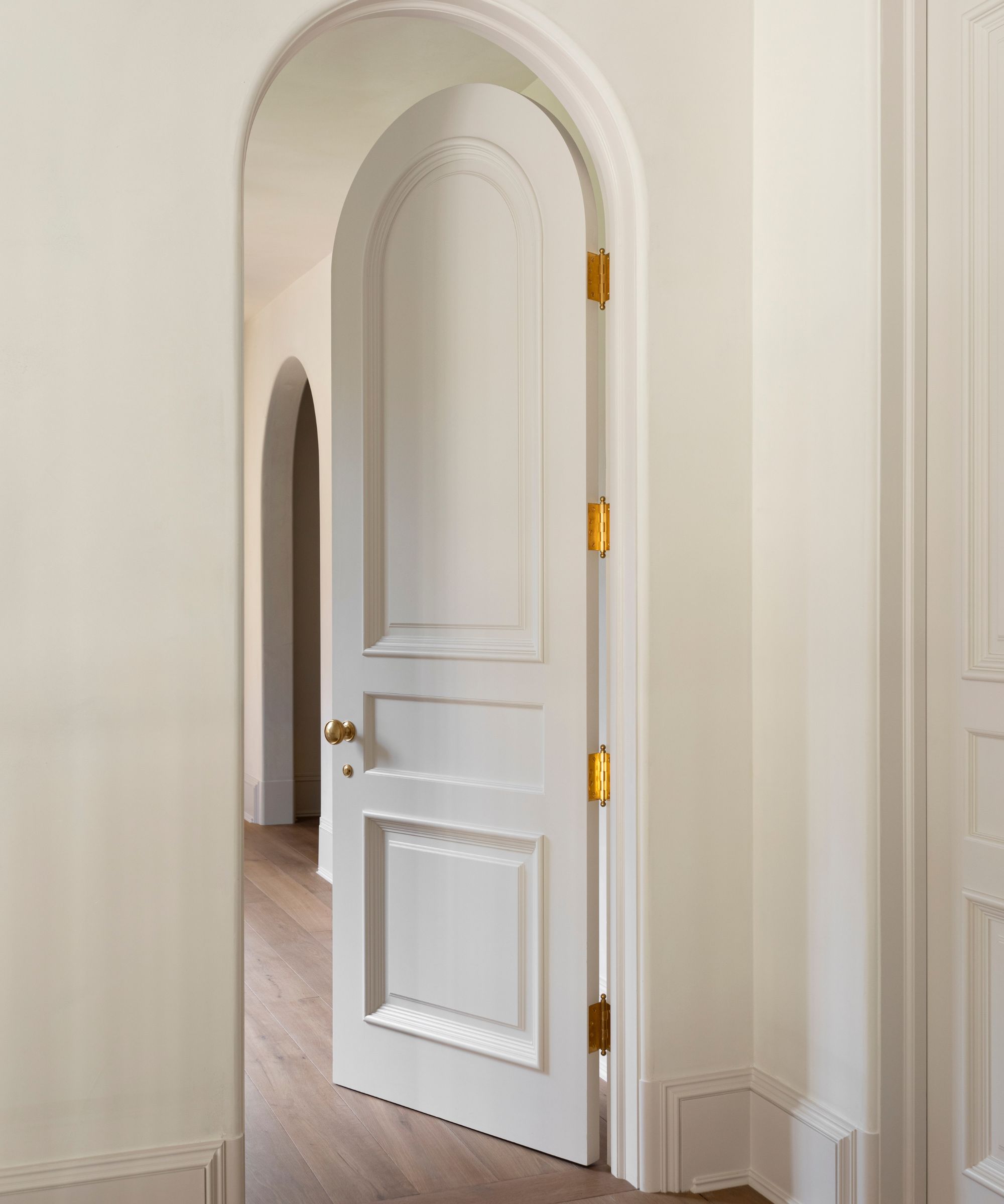 A simple, light biege entryway painted in Drift of Mist by Sherwin-Williams