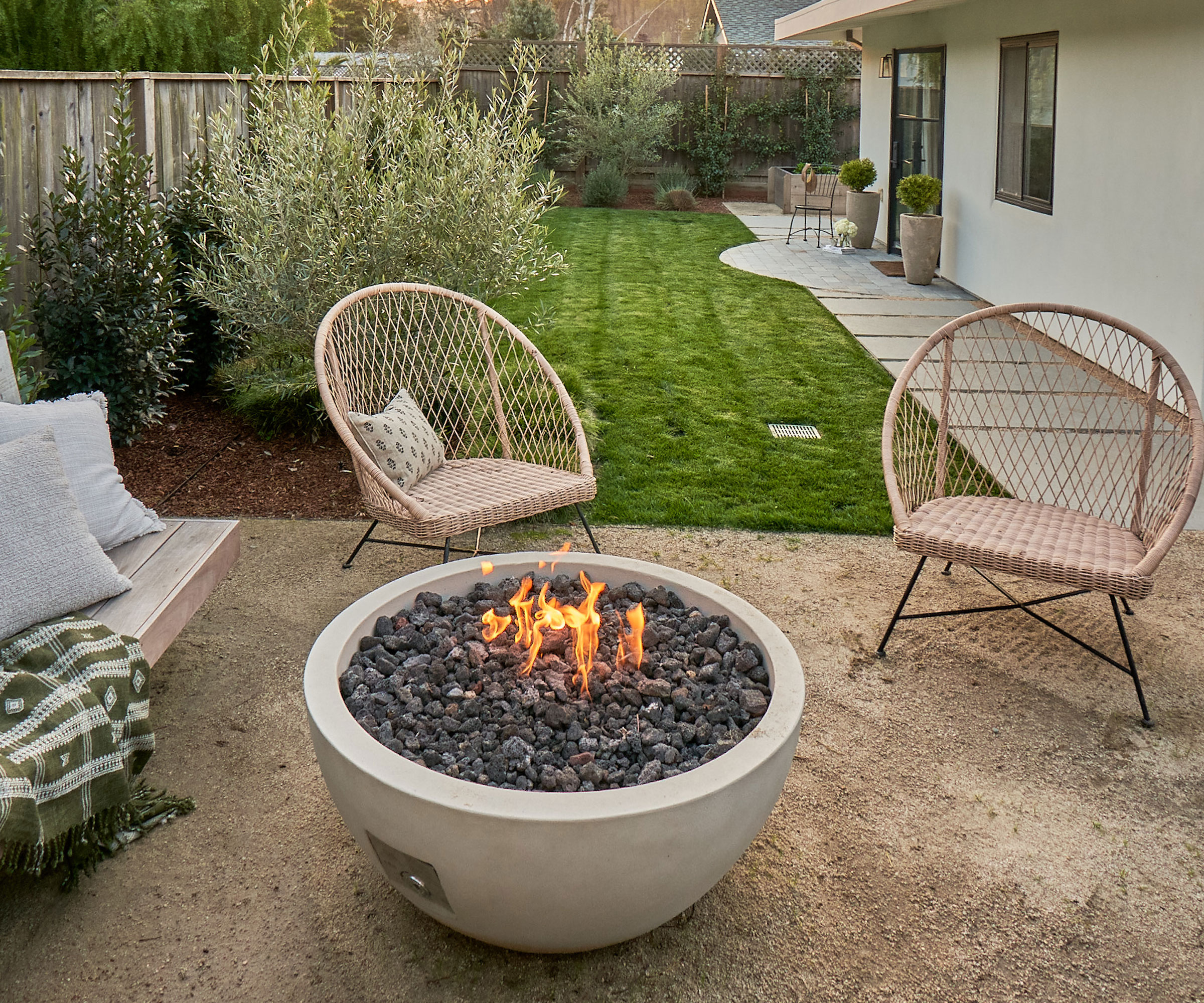 garden design with firepit, bench and chairs