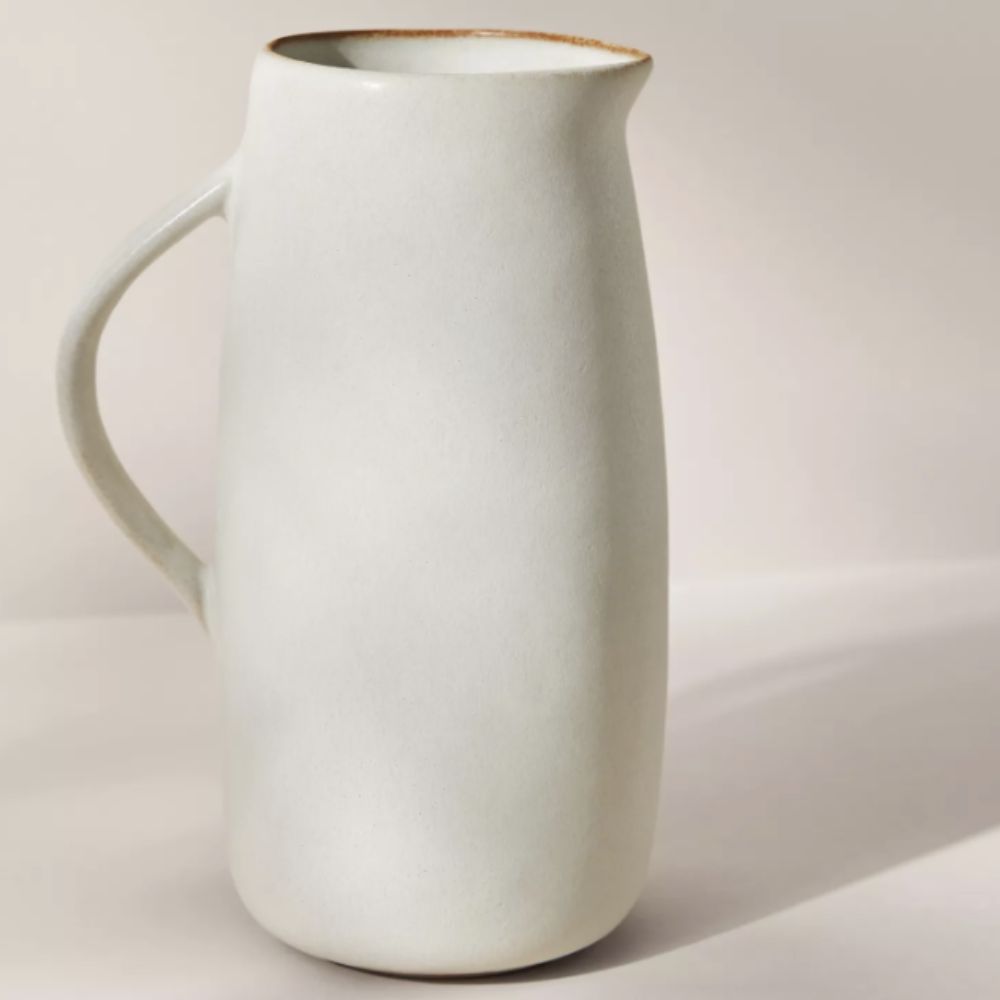 off-white stoneware jug on neutral background